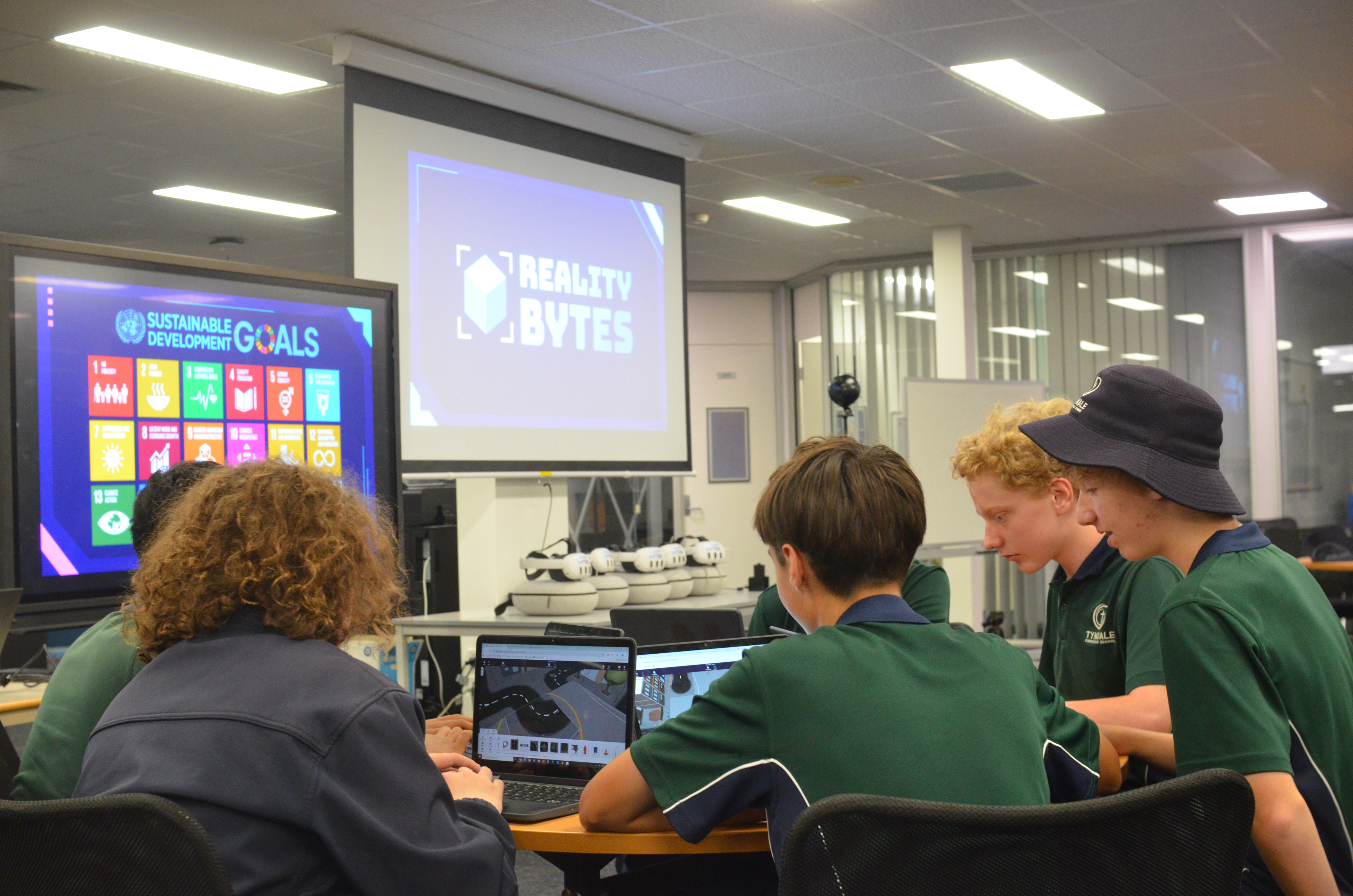 Students working in a group to design a sustainability-focused VR project during a Reality Bytes Media school incursion
